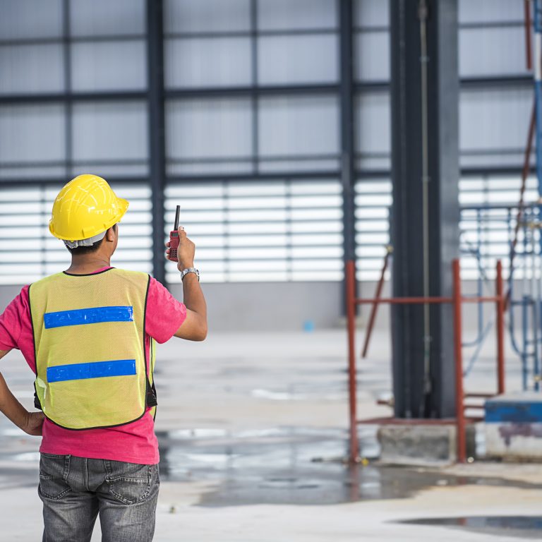 foreperson engineering working in warehouse construction site